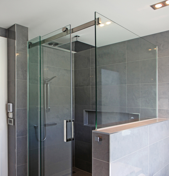 Great for adding the illusion of space, sliding showers are the modern alternative to the pivoting door. Image source:  Euro Glass