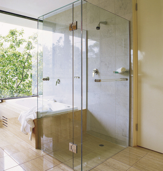 A great way to make optimal use of space in your bathroom, the bath-end shower is a popular layout in New Zealand. Image source:  Euro Glass