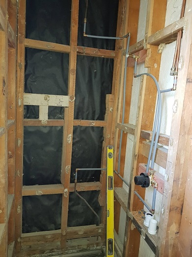 Pipework behind shower walls
